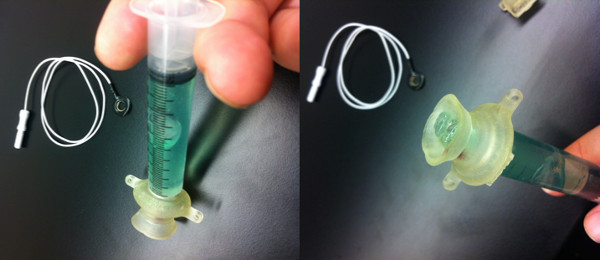 Syringe assembly for fluid injection, featuring tubing and connector; supports liquid chromatography.
