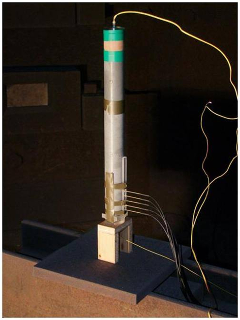 Seismic monitoring setup with sensors and wires for ground motion analysis.