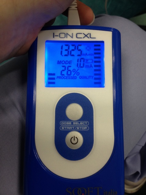 Electronic device measuring current in an experiment; digital display indicating 1.325 mA, 26% processed.
