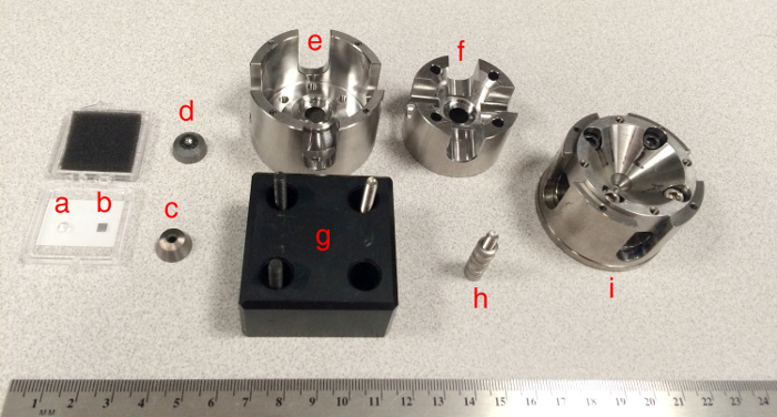 High-pressure cell components for spectroscopy setup, illustrating assembly and labeling.