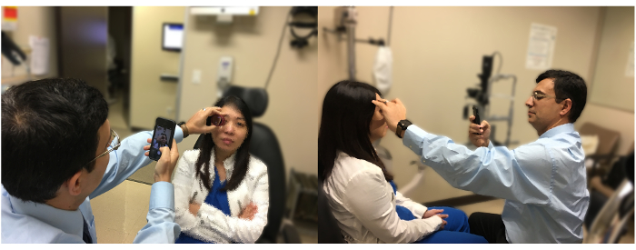 Eye examination setup, optometrist using a smartphone for diagnostic imaging, clinical procedure.