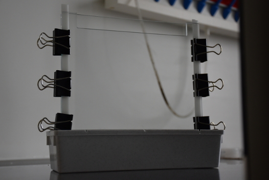 DIY static equilibrium experiment setup with binder clips, balance beam apparatus, educational physics.