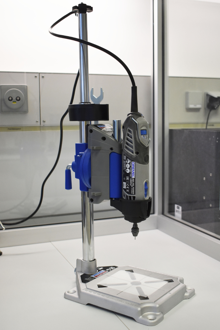 Rotary tool workstation setup for precision drilling and cutting in a laboratory environment.