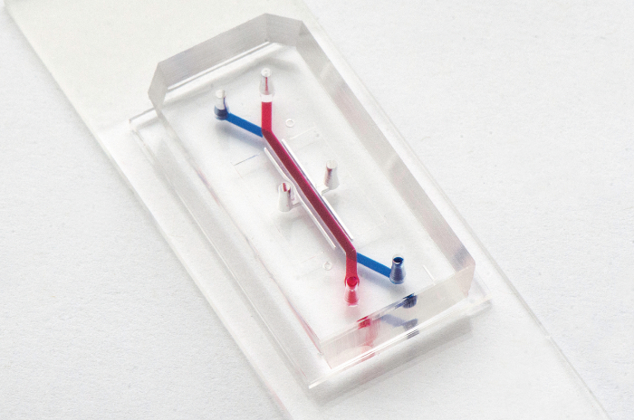 figure-results-3 Microfluidic device diagram, lab-on-a-chip setup for fluid control in microchannels, biomedical research.