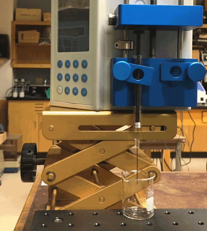 Laboratory titration setup with burette and magnetic stirrer, used for chemical analysis.