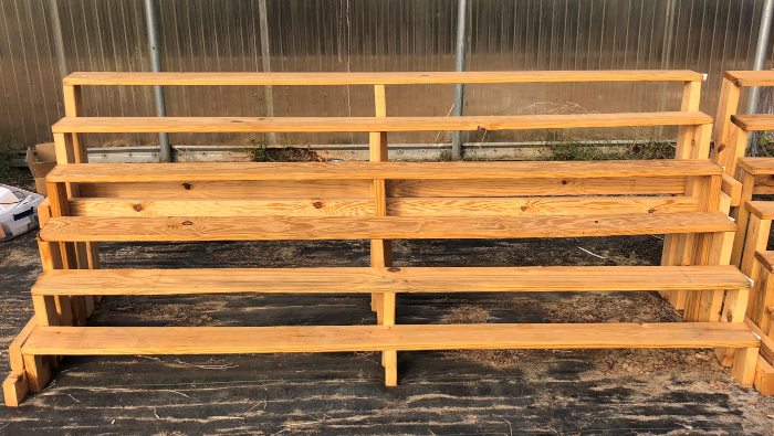 figure-protocol-1 Wooden bleachers, outdoor seating structure used for audience arrangement at events or venues.