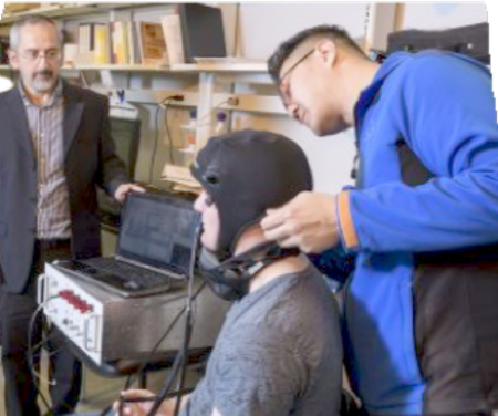EEG monitoring setup; brain activity experiment; data analysis; neuro research lab; headset use.