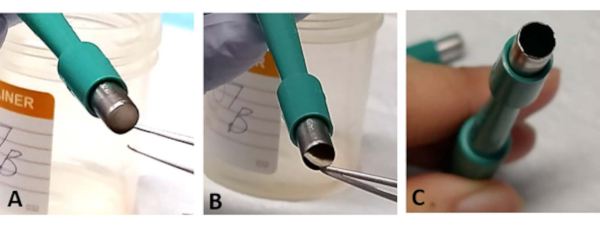 Examination of electrode surface preparation in microscopy setup for conductivity analysis.