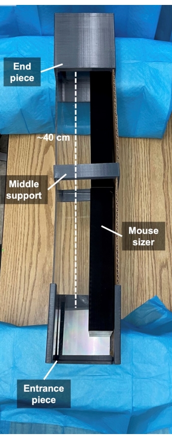 Mouse sizer setup diagram, showing entrance, middle support, end piece; used for rodent sizing.