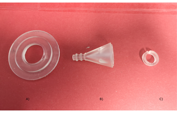 figure-introduction-9 Laboratory plasticware components for liquid transfer setup, including adapters and seals.