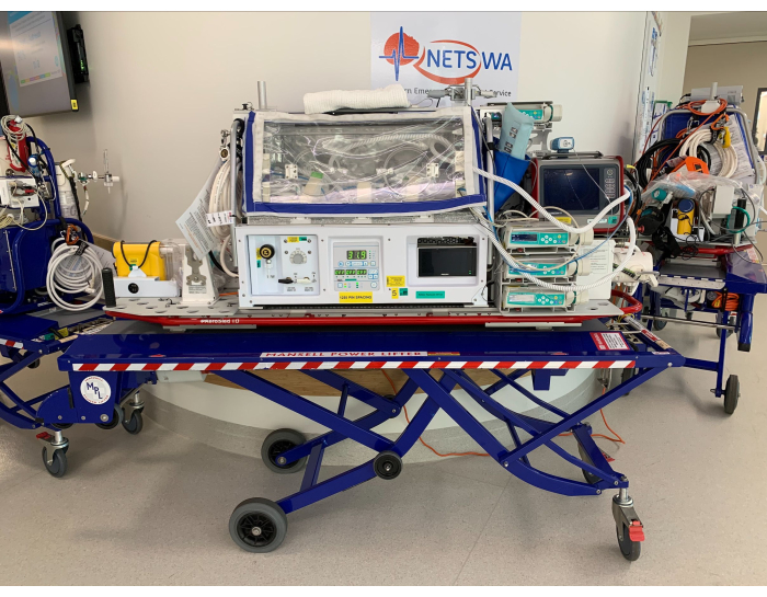figure-results-7 Neonatal transport incubator setup with medical equipment for emergency patient care and monitoring.