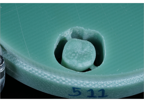 Hole damage inspection in composite material, emphasizing structural integrity analysis.