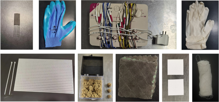 figure-protocol-1 Research equipment setup featuring electrical wires, gloves, and materials for a scientific experiment.