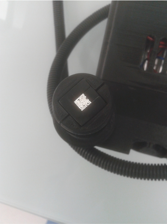 figure-discussion-2 Optical fiber inspection probe showing illuminated fiber end-face for analysis and diagnostics.
