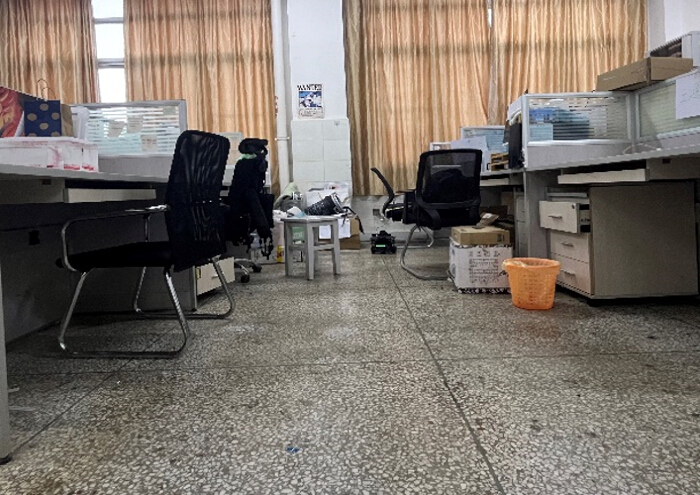 figure-results-14 Laboratory workspace setup, featuring desks, office chairs, and assorted lab equipment.