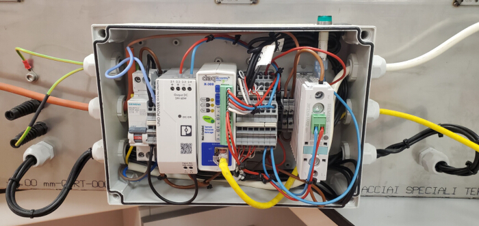 Control system diagram; electrical wiring setup for automation; industrial equipment configuration.