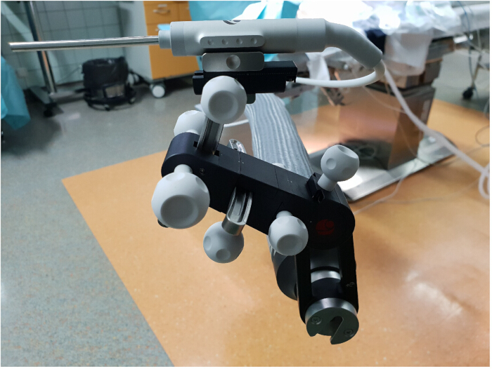 Surgical robotic arm, precision positioning, medical equipment in operating room setup.