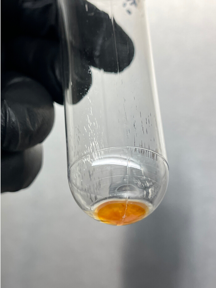 Test tube reaction, orange precipitate formation, chemical experiment result, analysis concept.