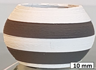 figure-results-6 3D printed small spherical object for material science study, measuring scale in millimeters.